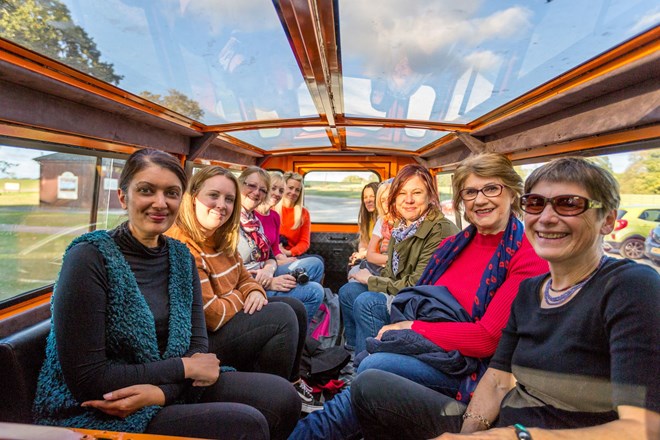 Group inside glass top Bigfoot VIP Safari Vehicle 